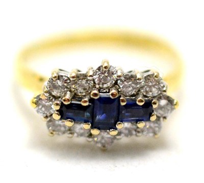 Lot 97 - An 18ct gold sapphire and diamond cluster ring