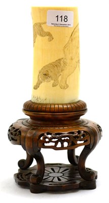 Lot 118 - A late 19th century Japanese ivory vase decorated with an elephant and three tigers raised on a...