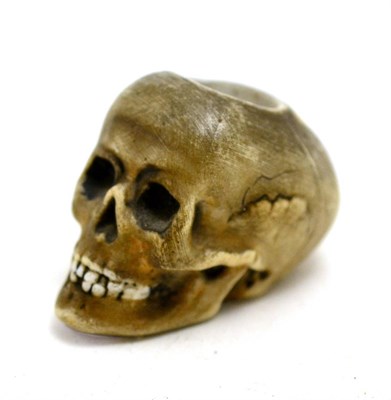 Lot 166 - A 19th century German porcelain match striker in the form of a skull