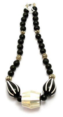 Lot 178 - A black bead and mother-of-pearl necklace