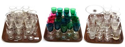 Lot 221 - A collection of glass, including a Georgian rummer, cranberry glass tazza, etc (on three trays)