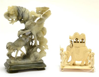 Lot 263 - Early 20th century Indian carved ivory group of an elephant and attendance; and a soapstone carving