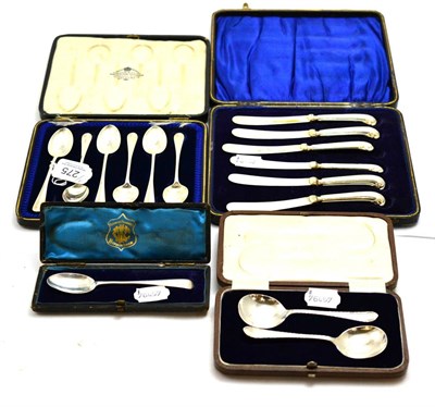 Lot 275 - Six silver pistol handled knives, six teaspoons, pair of silver spoons and a teaspoon (all cased)