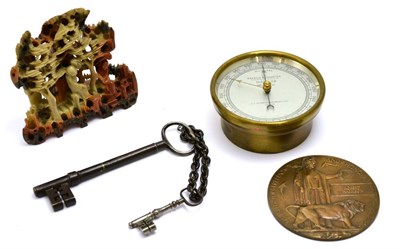 Lot 276 - Aneroid barometer, two keys, soapstone figure and a circular plaque