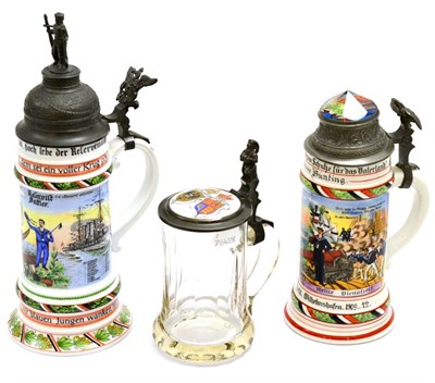 Lot 292 - Two Continental china steins with pewter mounts and another glass example