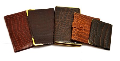 Lot 307 - A 1930's crocodile wallet with French 18ct gold corners, two unmounted wallets, a cigarette...