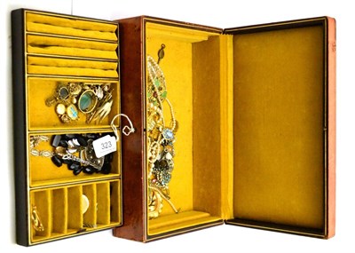 Lot 323 - Leather jewellery case containing assorted jewellery including gold pendant, brooch, etc