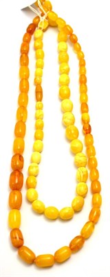 Lot 327 - An amber bead necklace and an amber type necklace