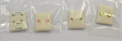 Lot 336 - Three pairs of emerald earrings, a pair of pink sapphire earrings and a pair of peridot earrings