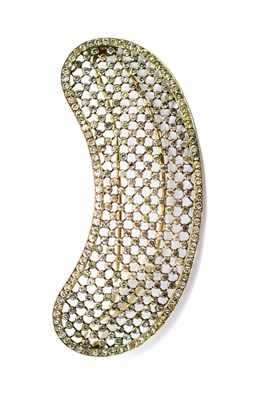 Lot 354 - A hair ornament of curved form, with white paste stones inset in grid fashion linked by fine...