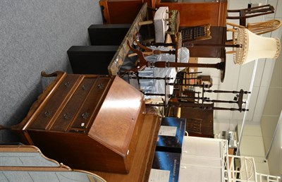 Lot 1031 - A reproduction walnut bureau, Deco style wall mirror, one other, two stools, standard lamp,...