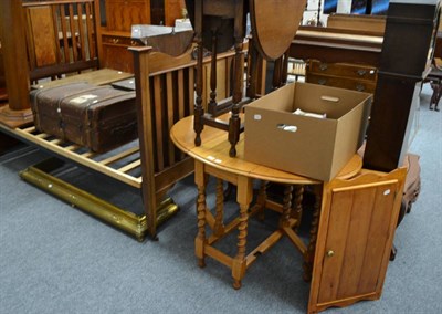 Lot 1043 - Oak glazed hanging corner cabinet, cabin trunk, brass fender and two oak drop leaf tables (5)