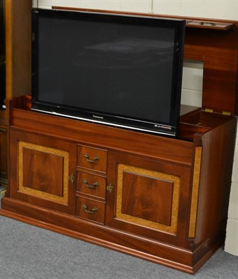 Lot 1045 - A Charles Barr TV cabinet enclosing a Panasonic plasma TV