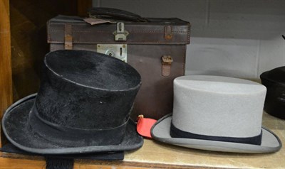 Lot 1049 - Three moleskin top hats including Moss Bros. together with a mortar board