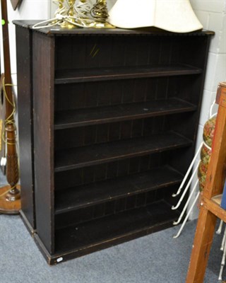 Lot 1052 - A pair of stained pine open bookcases