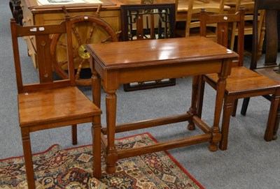 Lot 1116 - A pine table and two chairs