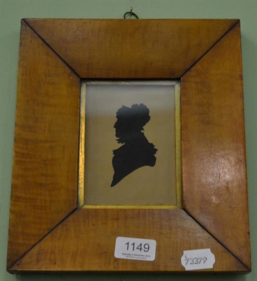 Lot 1149 - A silhouette in a maple frame