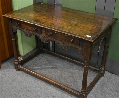 Lot 1180 - 19th century carved oak side table