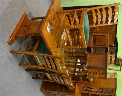 Lot 1192 - Modern country style dining room suite comprising refectory table, six ladder back chairs and a...