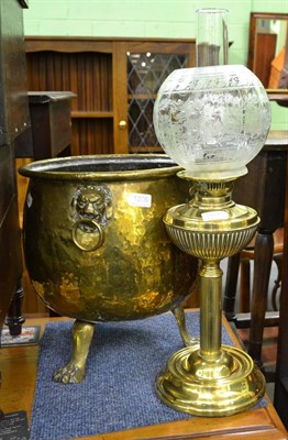 Lot 1206 - A brass oil lamp and shade and a hammered brass coal bucket