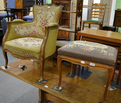 Lot 1209 - French style armchair with floral woolwork upholstery and a similar footstool (2)