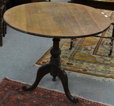 Lot 1223 - Victorian oak tripod table with circular top