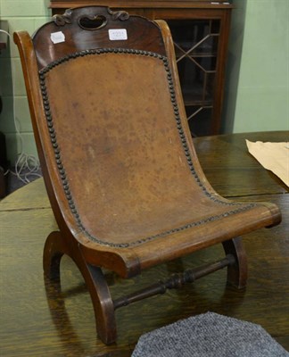 Lot 1231 - Mahogany X-framed child's chair with leather seat