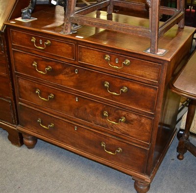 Lot 1262 - A George III mahogany chest of drawers with two short and three long drawers on turned baluster...