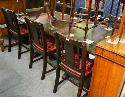 Lot 1276 - An early 20th century oak draw leaf dining table, six chairs and sideboard