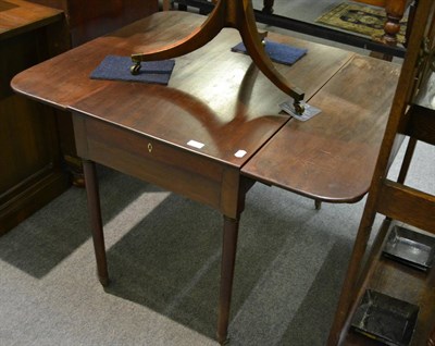 Lot 1291 - An early 19th century mahogany drop-leaf table, with ivory lock plates to drawer (a.f.)