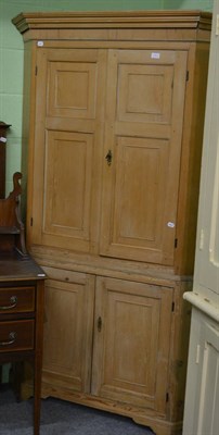 Lot 1300 - A floor standing pine corner cupboard