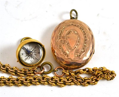 Lot 18 - A locket, a compass pendant and a bracelet