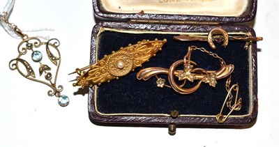 Lot 30 - Three early 20th century brooches and a stone set pendant on chain