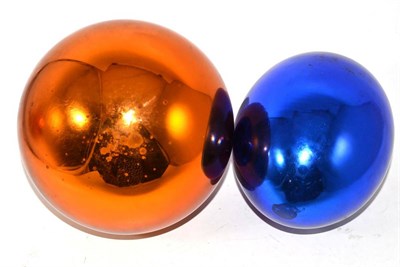 Lot 54 - A gold witches ball and a blue witches ball