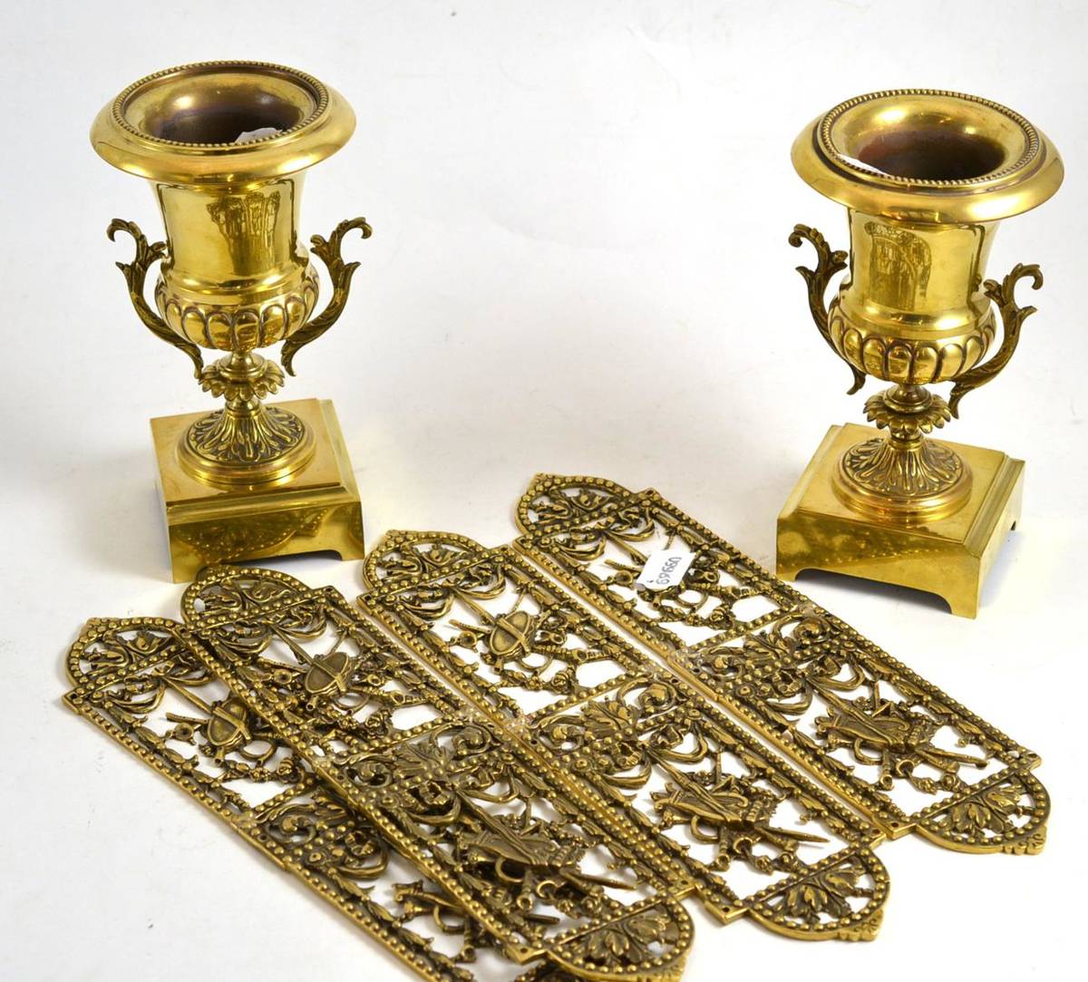 Lot 63 - A pair of brass urn shaped vases and four French style brass door finger plates (4)