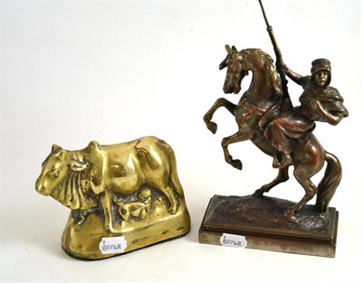 Lot 70 - After Paul Hertzel, Arab on a rearing horse and a brass figure of an Indian suckling cow