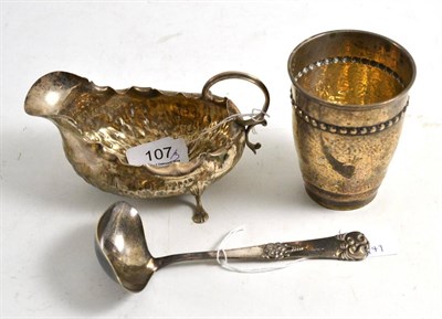 Lot 107 - A silver sauceboat (a.f.), a Danish beaker and spoon (3)