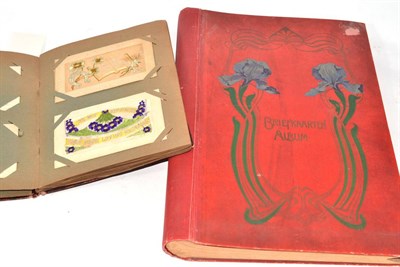 Lot 122 - A collection of World War I silk postcards in album together with an empty Art Nouveau album