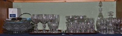 Lot 138 - A shelf of cut glass including wine glasses, champagne flutes, decanters etc