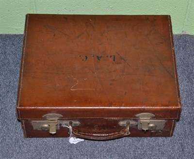 Lot 141 - Leather travelling case with silver topped jars