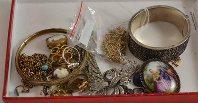 Lot 166 - A floral white metal bangle, paste and marcasite jewellery, a bar brooch (a.f.) and a cameo...