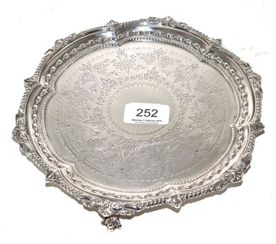 Lot 252 - A silver waiter, William Aitken, Birmingham 1906, with a beaded border and engraved decoration
