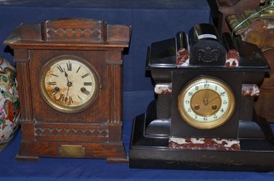 Lot 255 - A black slate and marble striking mantel clock and a German striking mantel clock