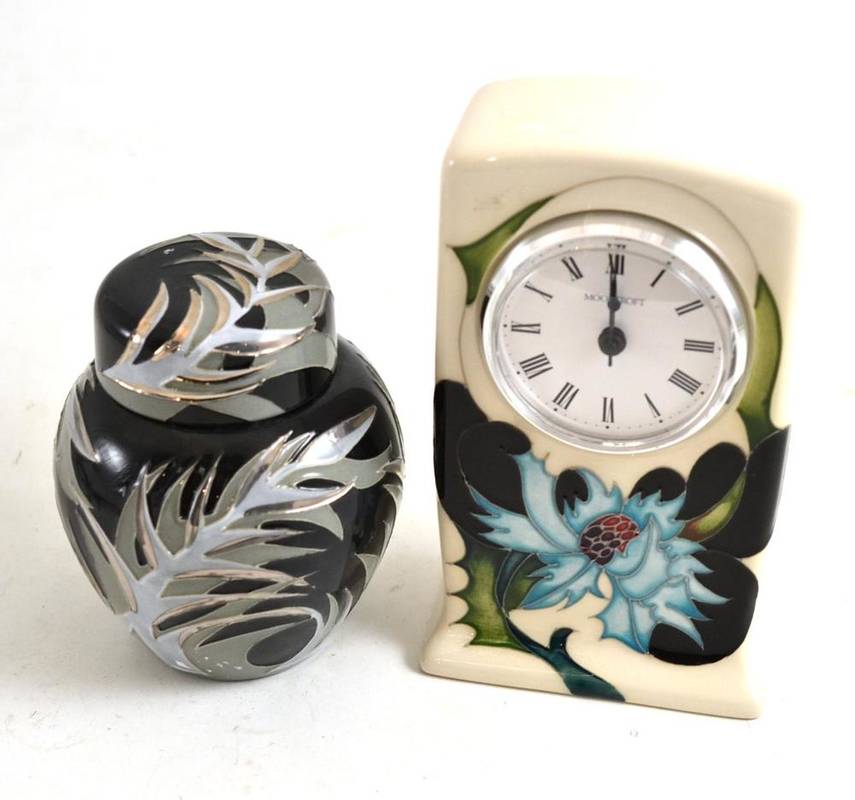 Lot 306 - A modern Moorcroft clock and a modern Moorcroft ginger jar and cover, numbered 23/75