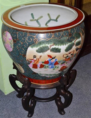 Lot 313 - A Chinese fish bowl on hardwood stand