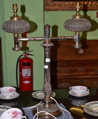 Lot 317 - An Old Sheffield plate oil lamp with cut glass fonts, converted for electricity