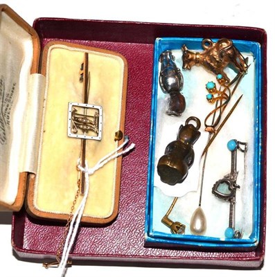 Lot 330 - A turquoise brooch, a pearl and enamelled bar brooch (cased), assorted pins and charms