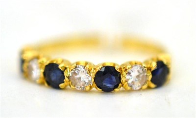 Lot 341 - An 18ct gold sapphire and diamond half hoop ring