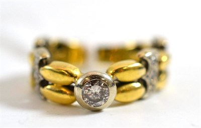 Lot 347 - An 18ct gold diamond set two colour flexible ring