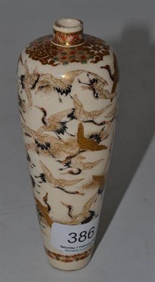 Lot 386 - A Japanese Satsuma vase decorated with flying cranes, with gilt decoration, signed to base